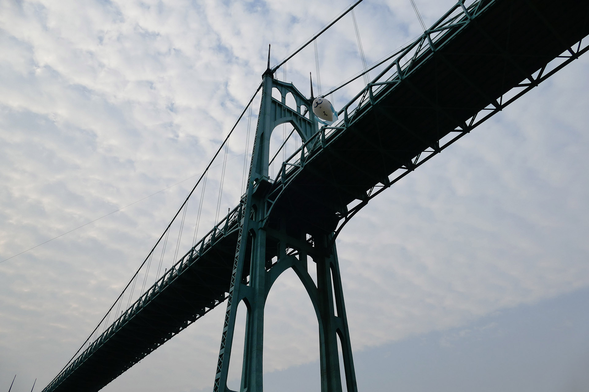 Airpup mascot by Justin Nichol in flight by the St. Johns Bridge in Portland, OR