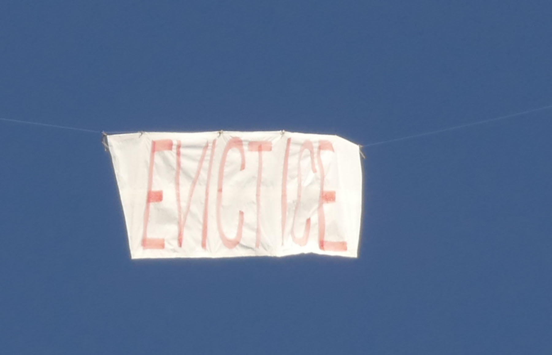 evict ICE banner flying in Fields Park, Portland